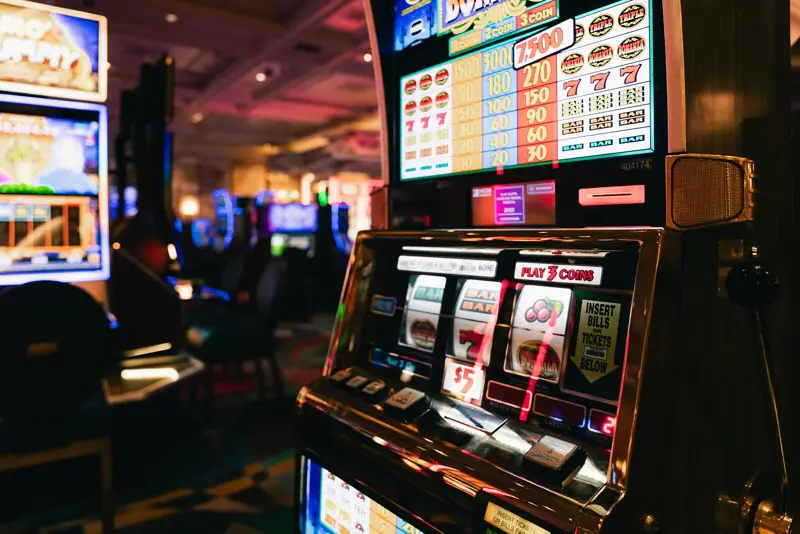Slot machines in a dim casino hall